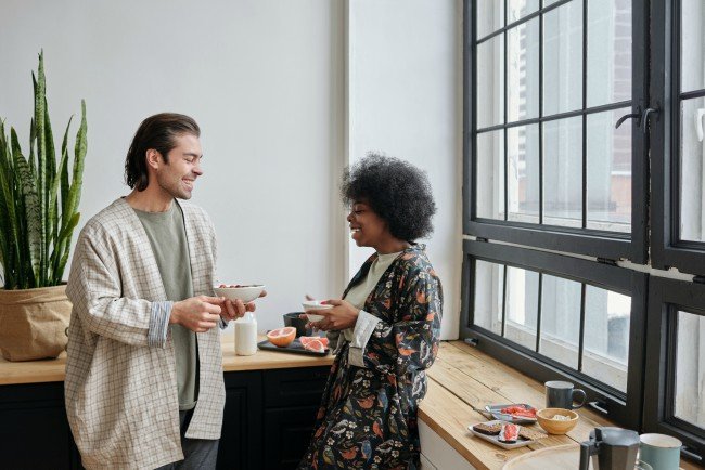 man and woman having breakfast